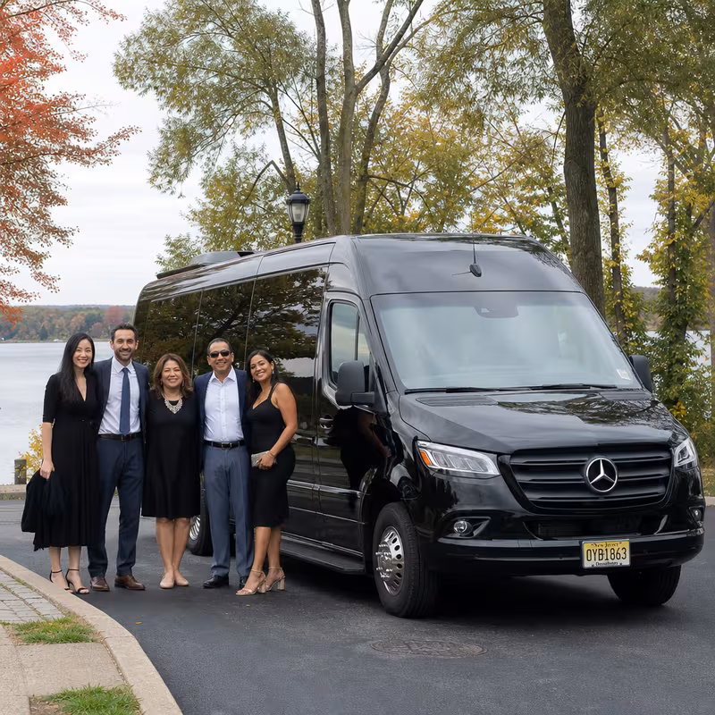 Group beside a Mercedes Sprinter limo from the Union fleet