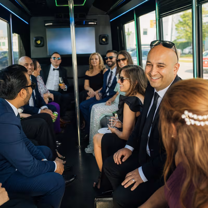 Wedding guests seated inside a Union party bus