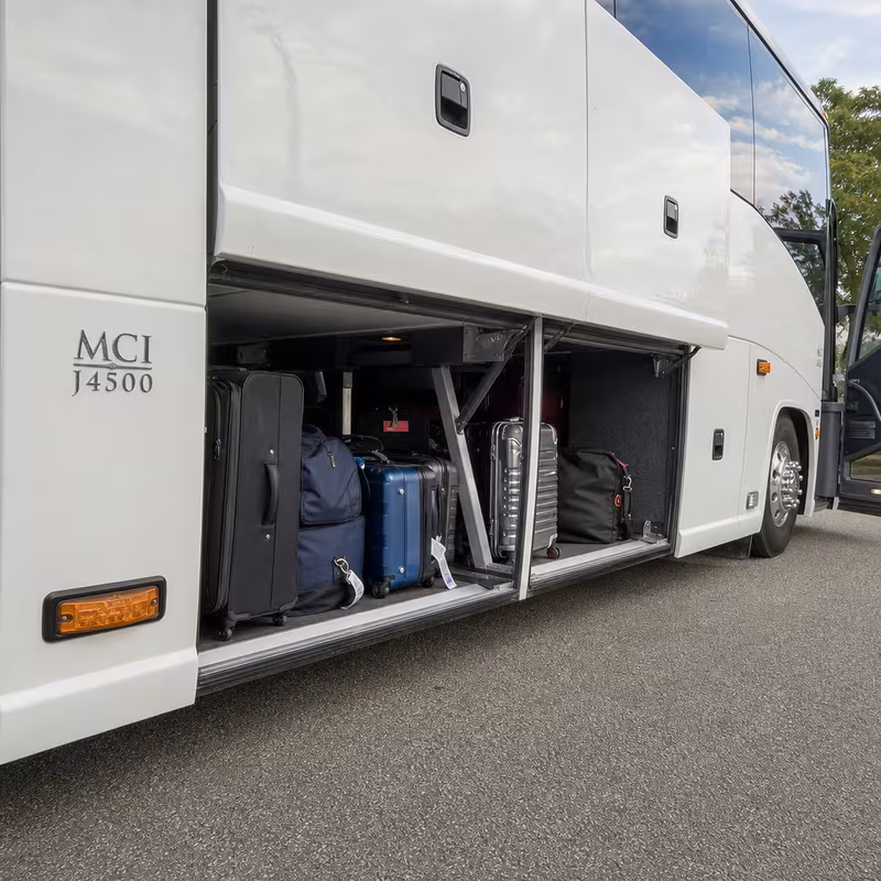 Party bus interior with wraparound leather seating and LED lighting in Union