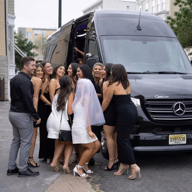 Group boarding a white charter bus for Bachelor & Bachelorette Transportation transportation in Union