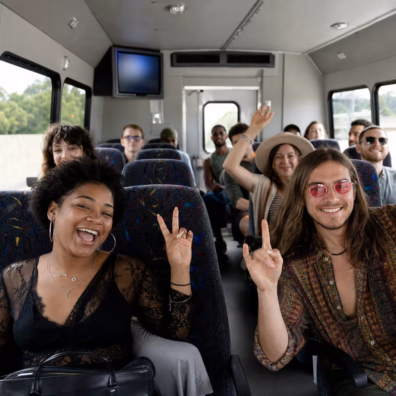 Party bus interior with wraparound leather seating and LED lighting in Union