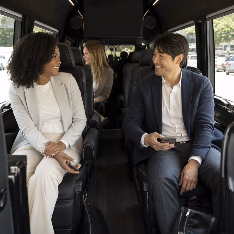 Passengers loading luggage while boarding an Union group shuttle