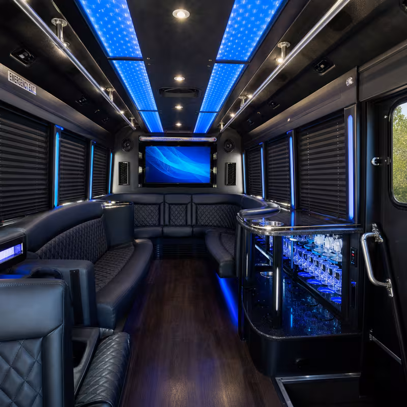 Party bus interior with wraparound leather seating and LED lighting in Union