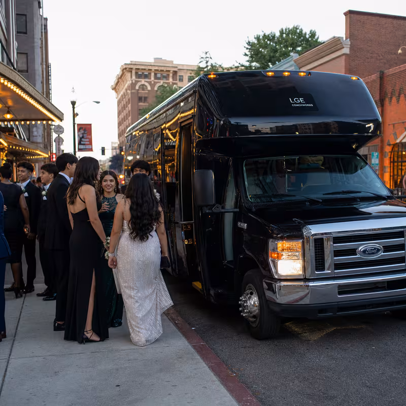 Passengers loading luggage while boarding an Union group shuttle