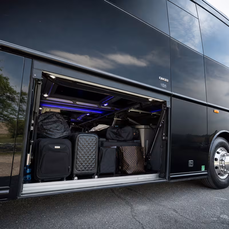 Party bus interior with wraparound leather seating and LED lighting in Union