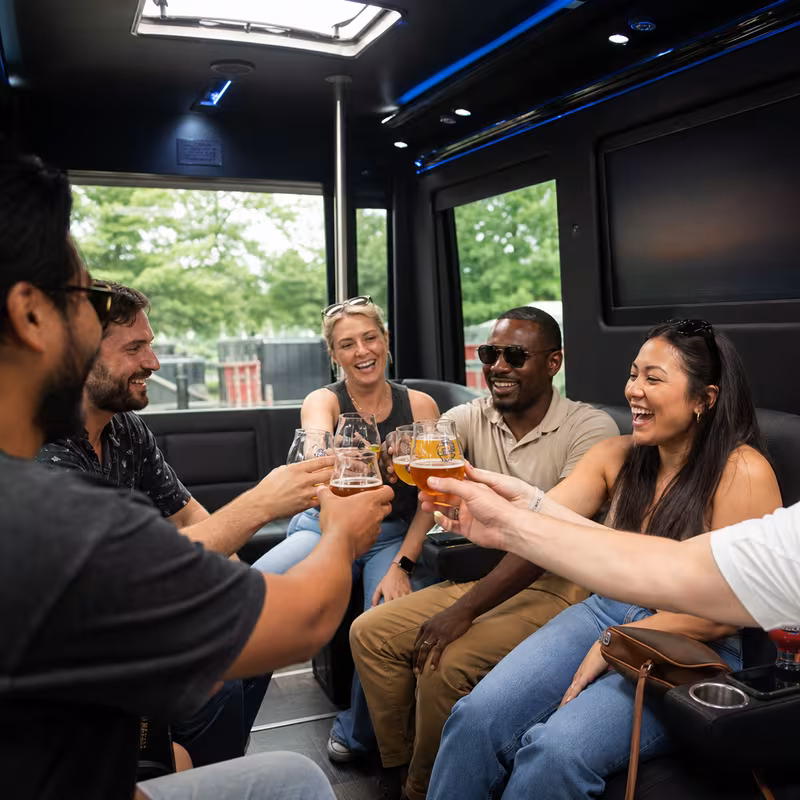 Group boarding a white charter bus for Winery & Brewery Tour Transportation transportation in Union